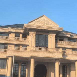 辽阳黄金麻别墅外墙干挂石材效果示例